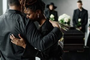 Family mourning a wrongful death at a funeral in New Iberia, Louisiana.